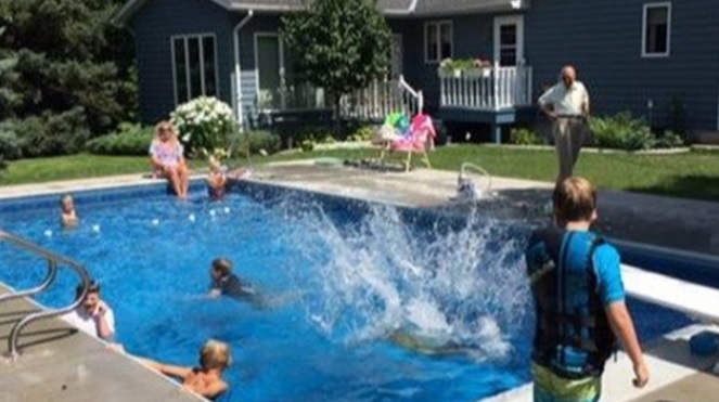 Kids swim in Keith Davidson's pool