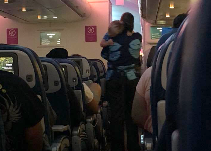 flight attendant calms baby